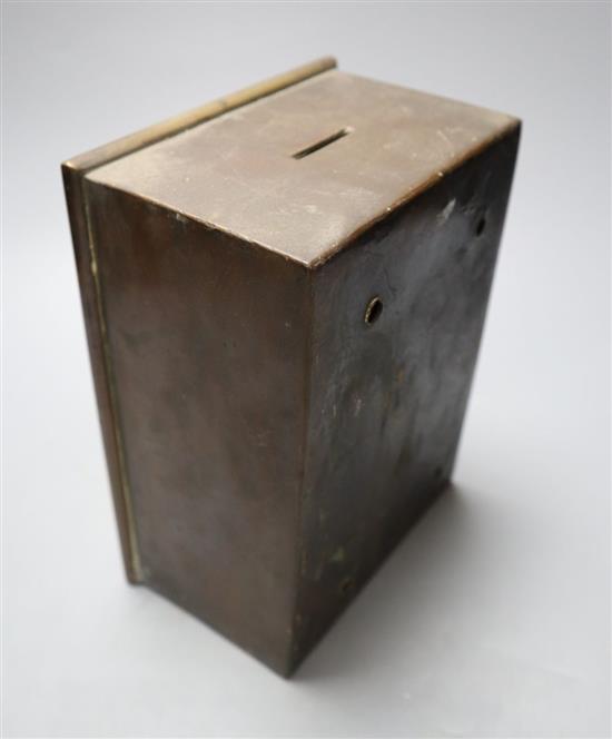 A brass money bank in the form of a safe, four drawers enclosed, height 21cm